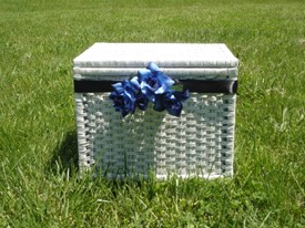 White rectangle basket with blue flowers on the front.